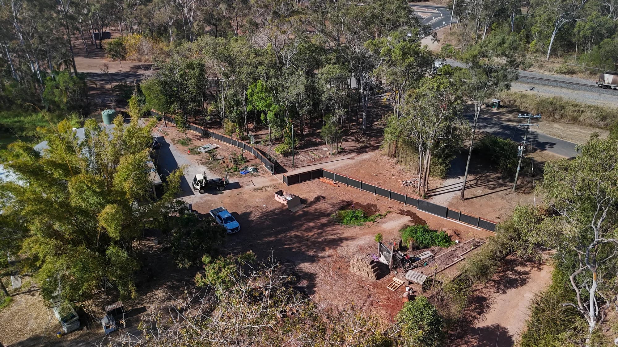Aerial view of a Colorbond fence around a wooded property