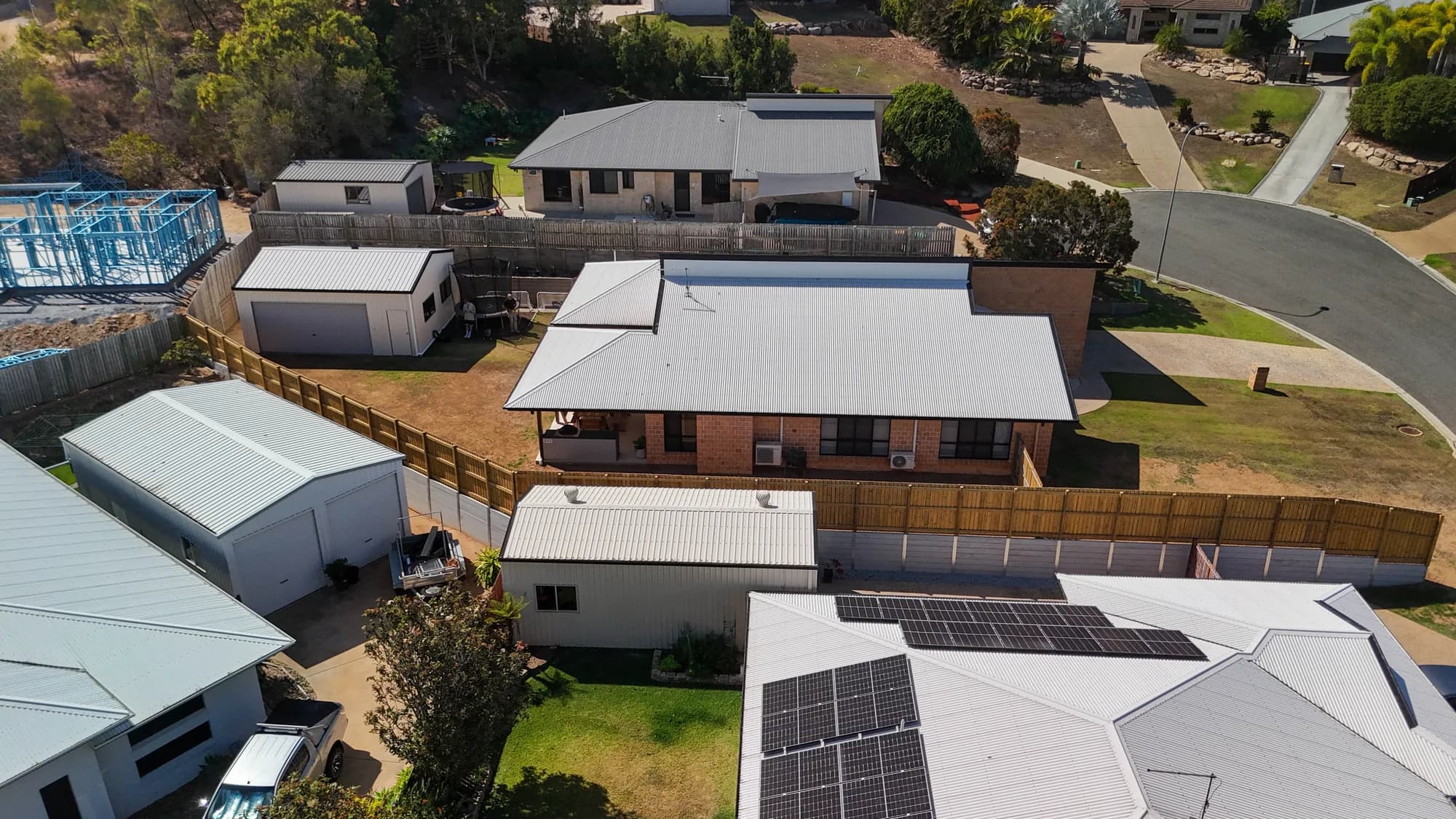 Aerial view of a home enclosed by timber fencing