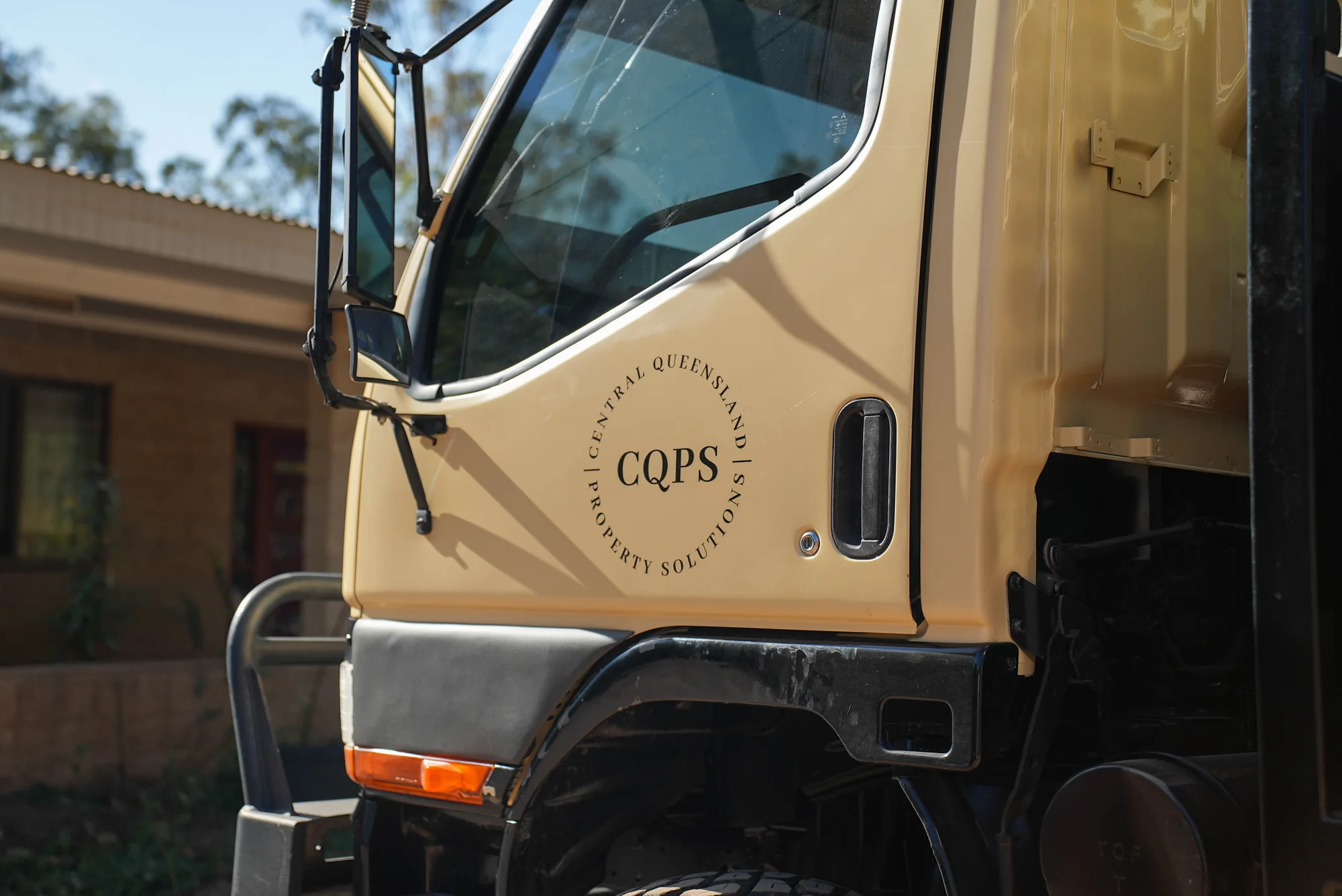 CQ Property Solutions logo on the work truck
