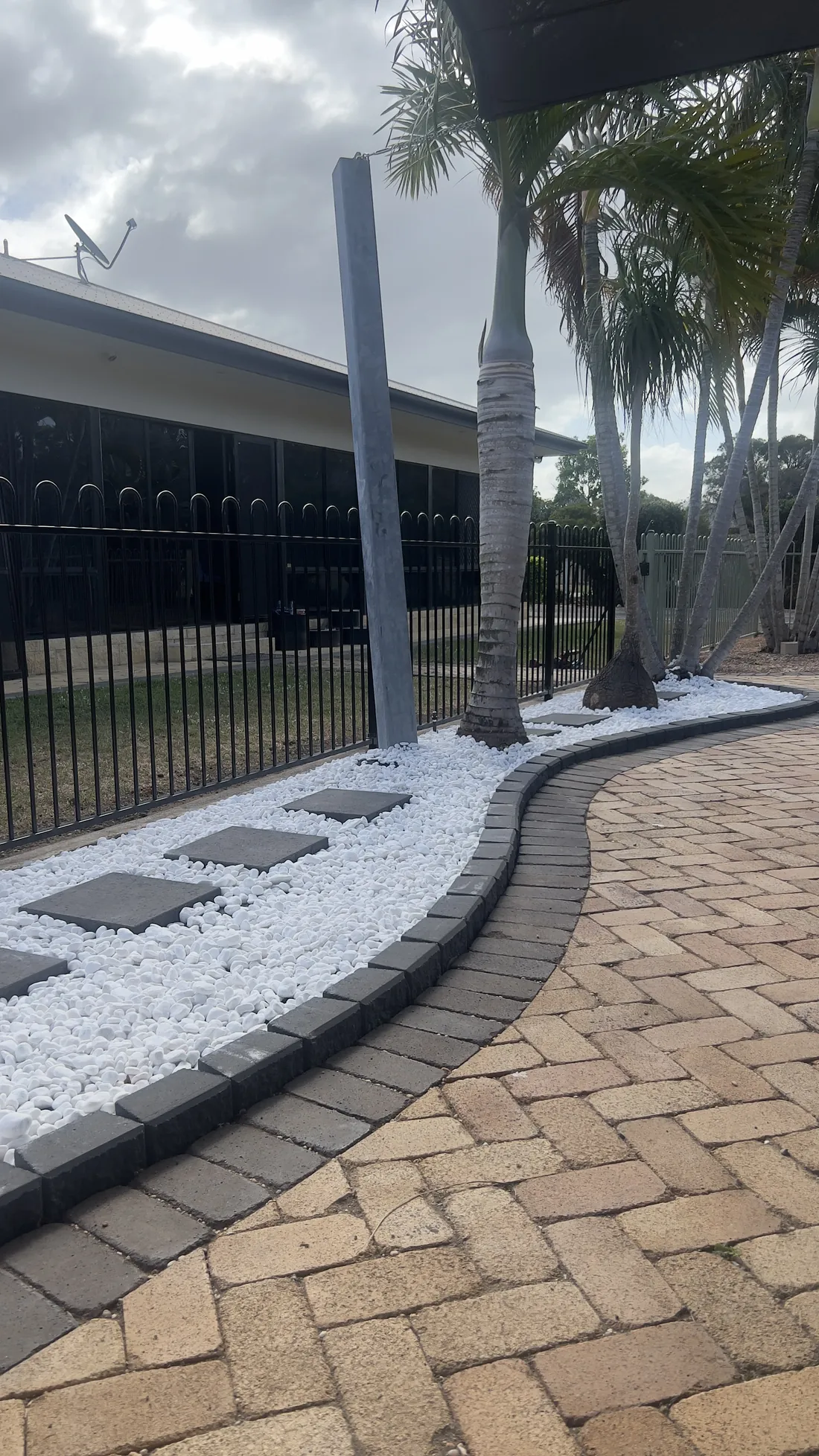 Paver path and pebble garden bed